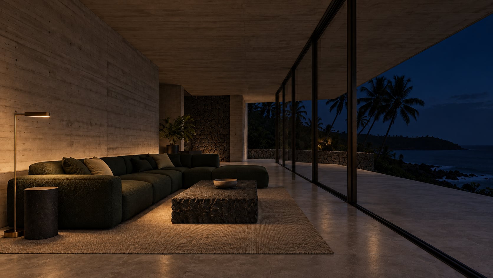 The living room at night, 21:00: concrete walls, a pine-green sofa, a basalt table and full-height glass to the sea